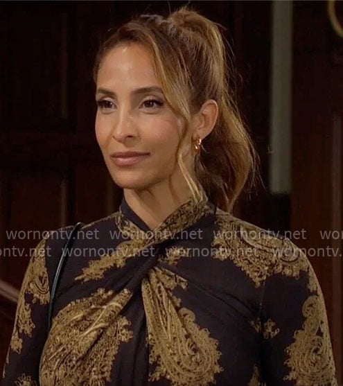 Lily’s black and gold printed cross-neck dress on The Young and the Restless