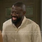 Malcolm’s beige striped shirt on The Neighborhood