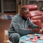 Malcolm's green Champion sweatshirt and sweatpants on The Neighborhood