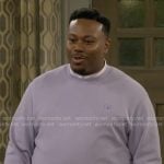 Marty’s lavender purple sweatshirt on The Neighborhood