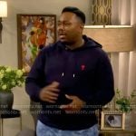 Marty’s navy hoodie and blue printed shorts on The Neighborhood