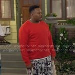 Marty’s red sweater and printed shorts on The Neighborhood