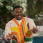 Marty’s orange retro print cardigan on The Neighborhood