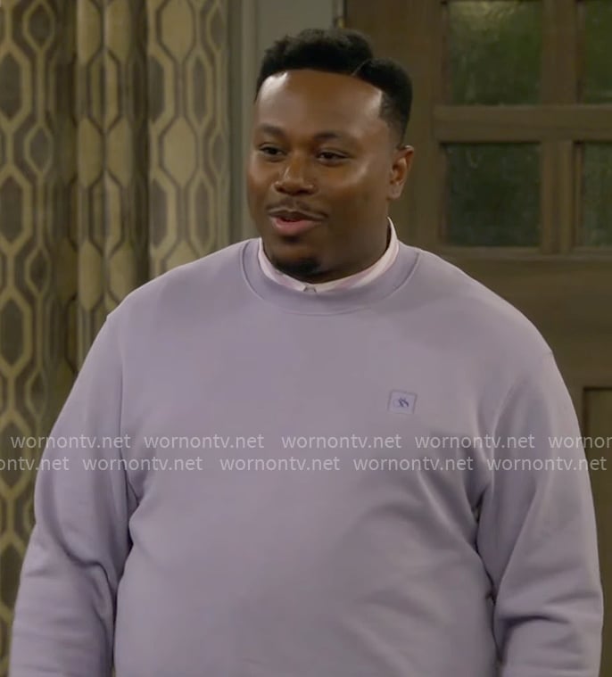 Marty's lavender purple sweatshirt on The Neighborhood