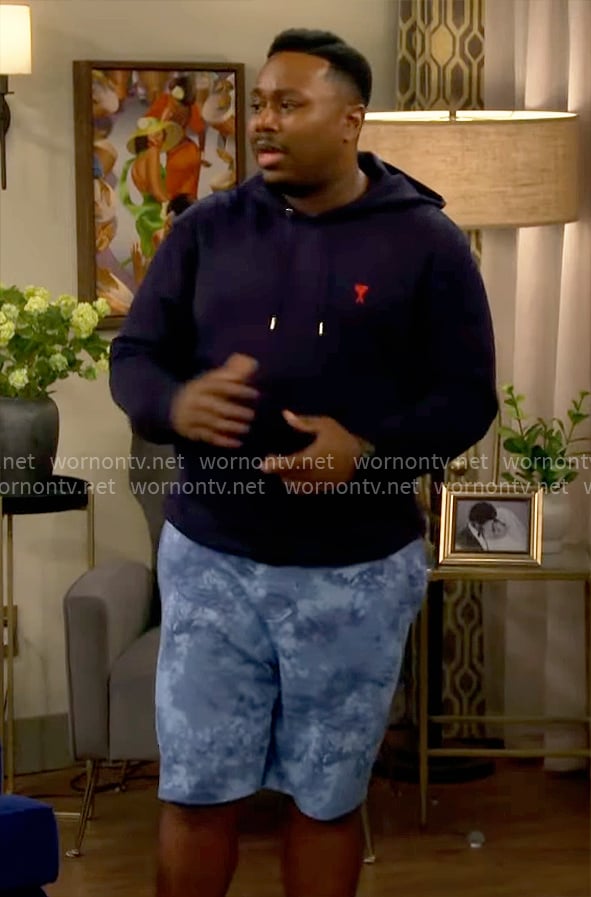 Marty's navy hoodie and blue printed shorts on The Neighborhood