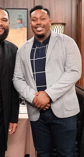 Marty’s navy windowpane check polo shirt on The Neighborhood