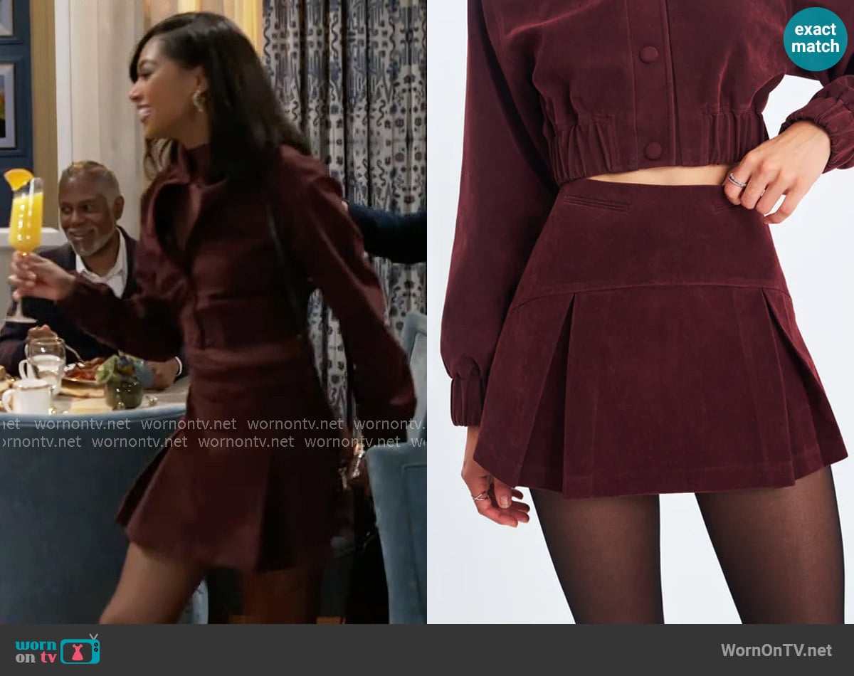 Kat’s burgundy suede skirt on Beyond the Gates