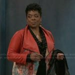 Mona’s red floral jacket on Beyond the Gates