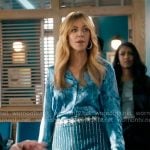 Morgan’s blue snake print shirt and rhinestone studded denim skirt on High Potential