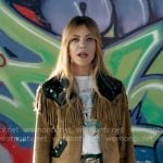 Morgan’s fringed suede jacket with graphic tee and blue textured mini skirt on High Potential