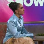 Robin Arzon's blue satin blouse and floral pants on The Kelly Clarkson Show