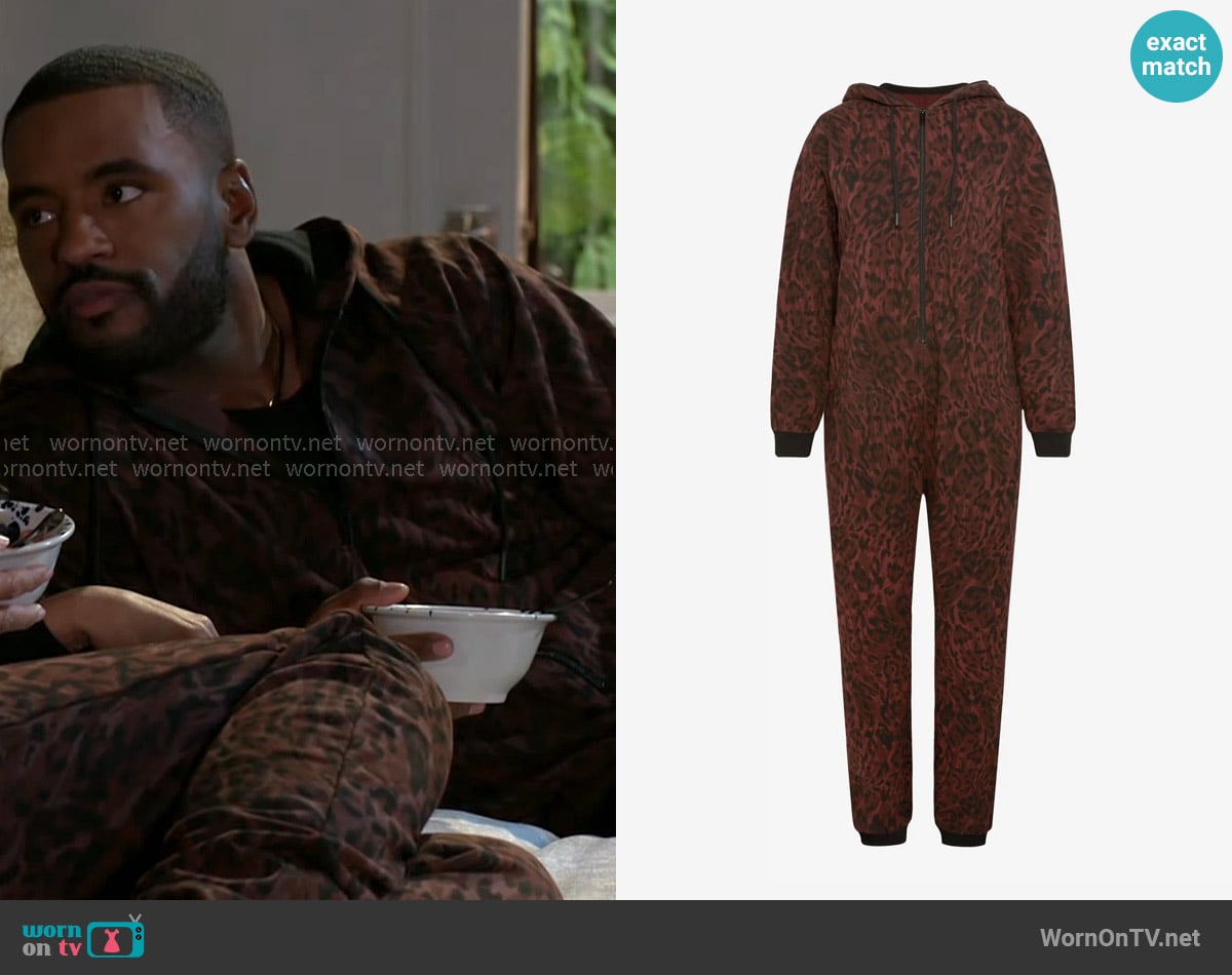 Andre’s leopard print onesie on Beyond the Gates