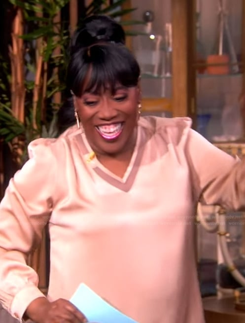 Sheryl’s pink v-neck top on The View
