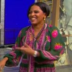 Tamron’s green and pink printed dress on Tamron Hall Show