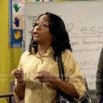 Tina’s gold cropped shirt on The Neighborhood