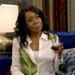 Tina's white leaf print shirt on The Neighborhood