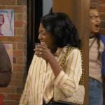 Tina’s yellow striped shirt on The Neighborhood