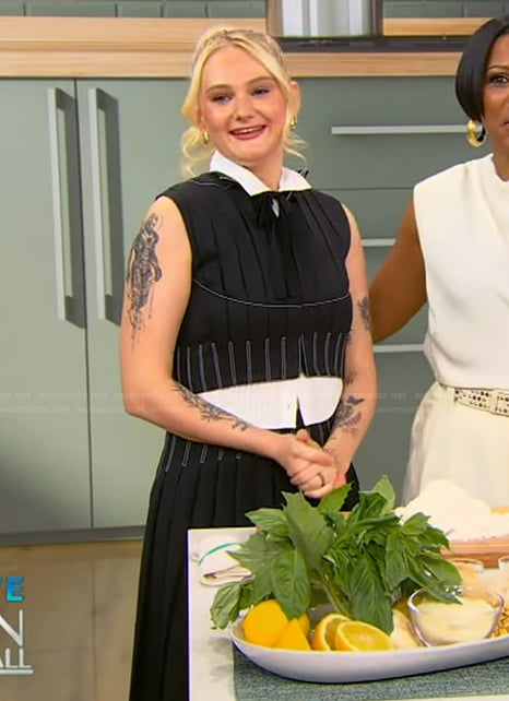 Tini Younger's black pleated top and skirt on Tamron Hall Show