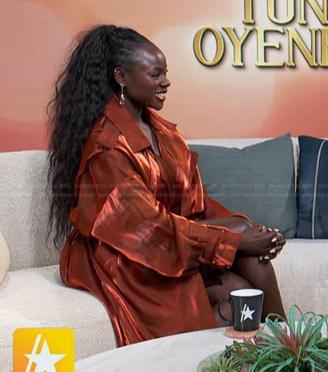 Tunde Oyeneyin’s orange satin dress on Access Hollywood