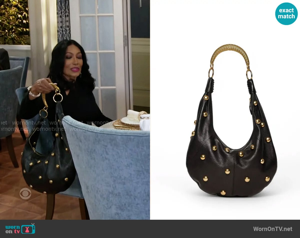 Walter Baker Miller Studded Hobo worn by Dana 'Leslie' Thomas (Trisha Mann-Grant) on Beyond the Gates