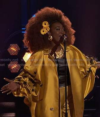 Alexia Jayy’s yellow feather trim coat on The Voice