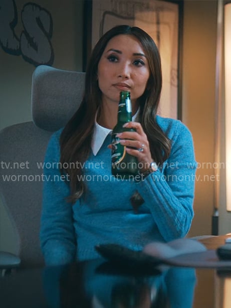 Ali’s blue sweater on Running Point