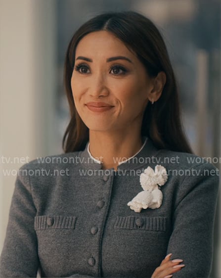 Ali's grey cardigan with flower applique on Running Point