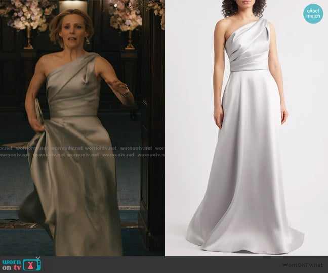 Gwen’s gray one shoulder gown on Elsbeth