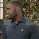 Andre's golf polo shirt on Beyond the Gates