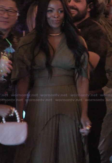 Ava’s khaki puff sleeve top and pleated pants on Abbott Elementary