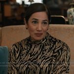 Jules’ black and gold metallic top on Elsbeth