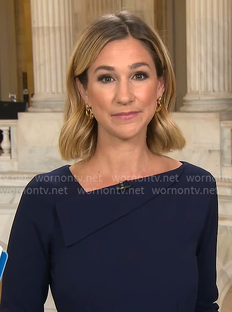 Caitlin Huey-Burns' navy asymmetric neckline dress on CBS Mornings