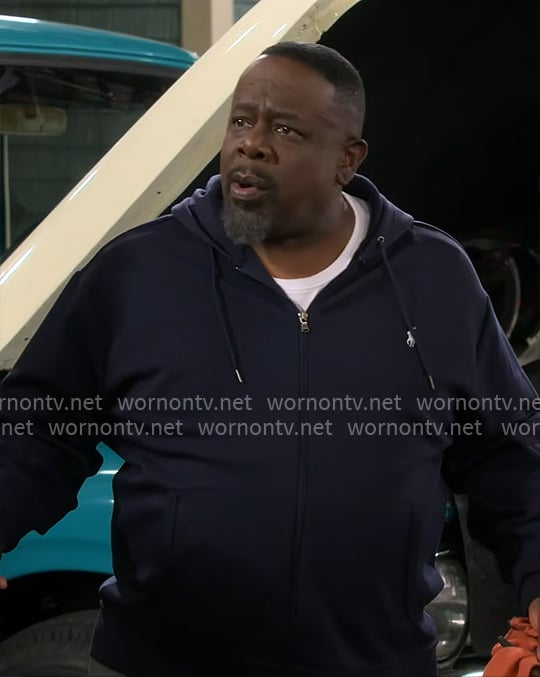 Calvin’s navy zip hoodie on The Neighborhood