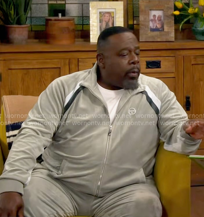 Calvin’s velour track suit with stripe details on The Neighborhood