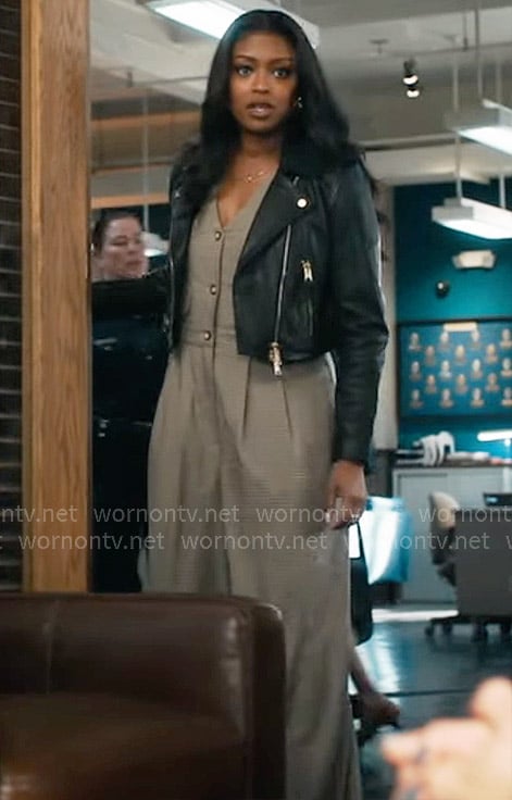 Daphne's checked v-neck jumpsuit and leather jacket on High Potential