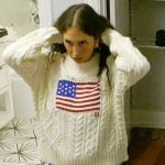 Dara’s cableknit American flag embroidered sweater on Summer House