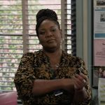 Dia’s black pleated wrap dress on Abbott Elementary