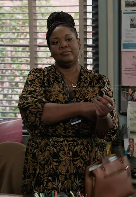 Dia's black pleated wrap dress on Abbott Elementary