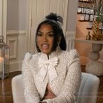 Drew’s metallic bow confessional jacket on The Real Housewives of Atlanta