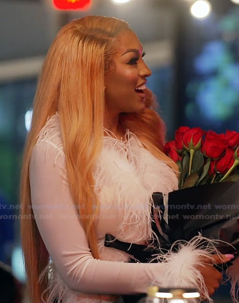 Drew's white feather trim top on The Real Housewives of Atlanta