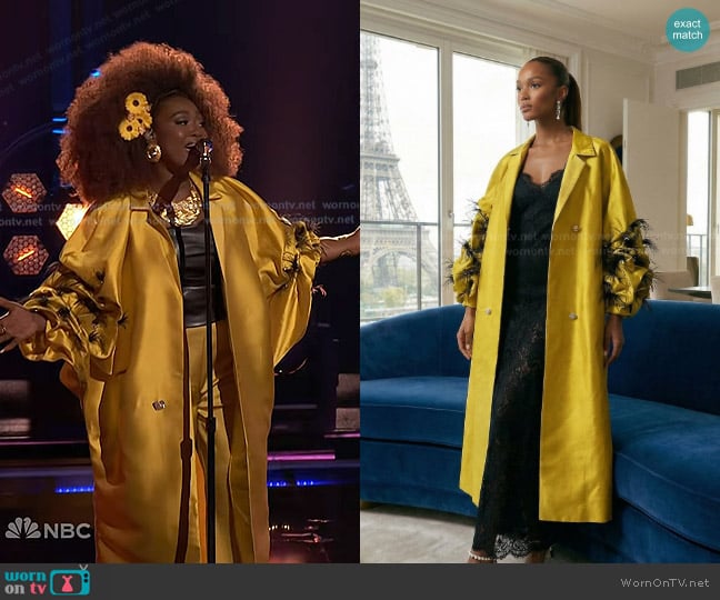 Alexia Jayy’s yellow feather trim coat on The Voice