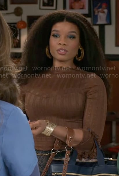 Eva’s brown lace top on Beyond the Gates