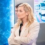 Gemma's black and white dotted shirt and beige pinstripe blazer on The Neighborhood