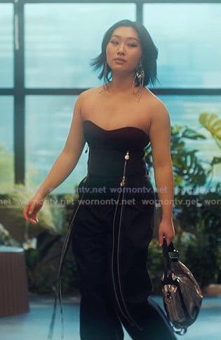 Gigi’s black zip detail strapless top on XO Kitty