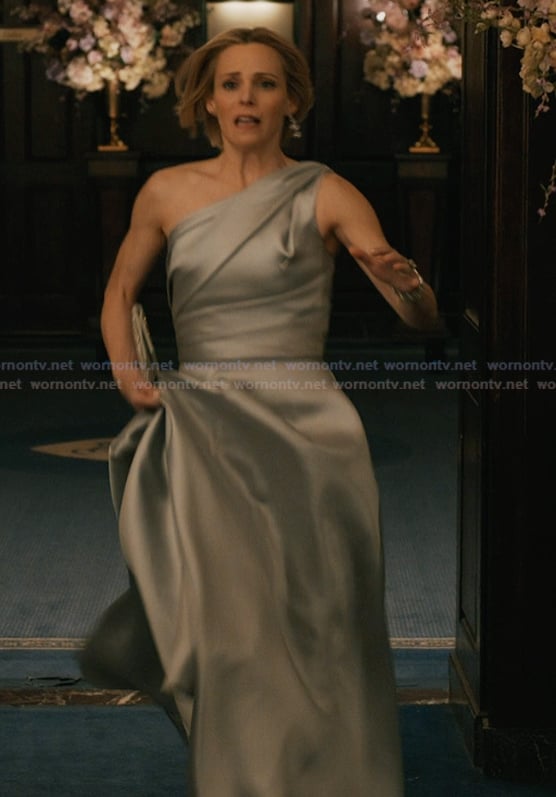Gwen’s gray one shoulder gown on Elsbeth