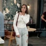 Emma’s white v-neck top with cutouts and floral jeans on General Hospital