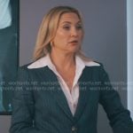 Isla’s navy pinstripe suit on Running Point