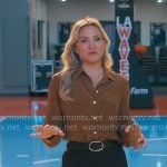 Isla's brown blouse with gold buttons on Running Point