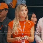 Isla’s red cap-sleeve belted drses on Running Point