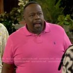 Calvin’s fuchsia pink polo shirt on The Neighborhood